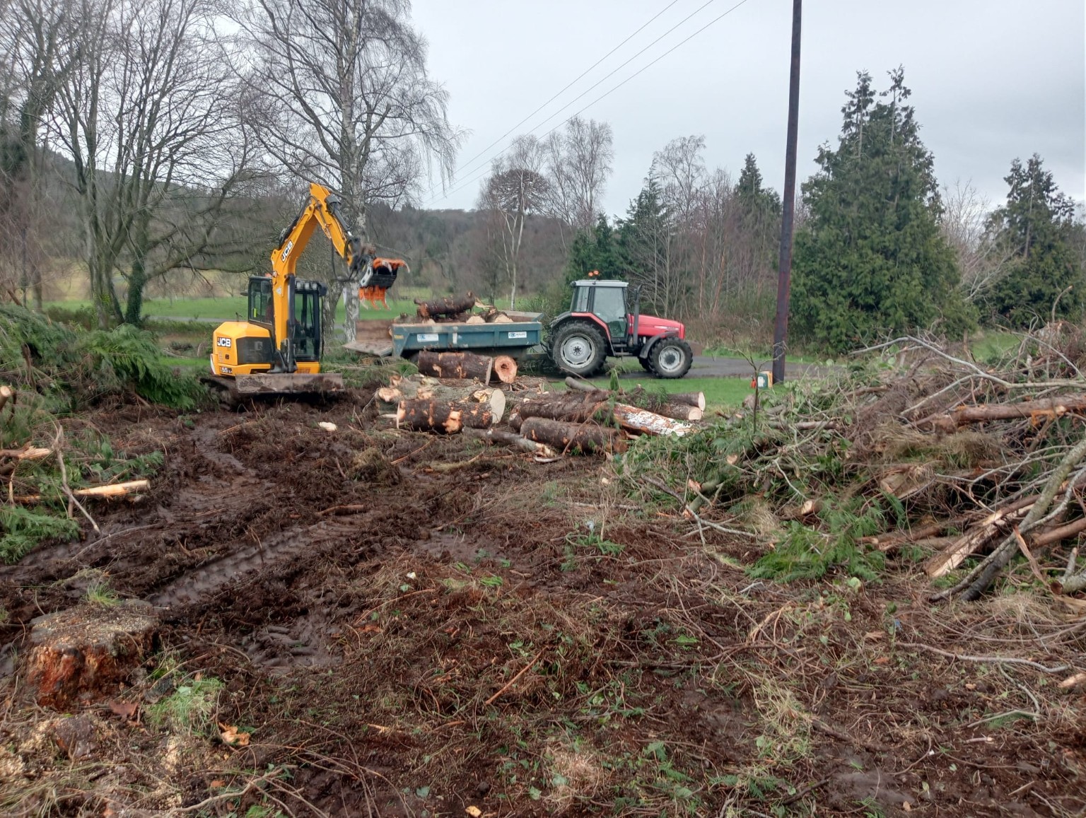 Site clearance using excavator and tractor